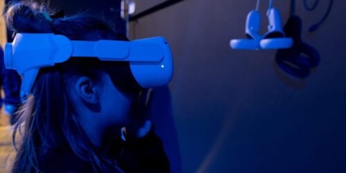 a-young-girl-using-virtual-reality-goggles-in-sensory-environment-scaled-1.jpg