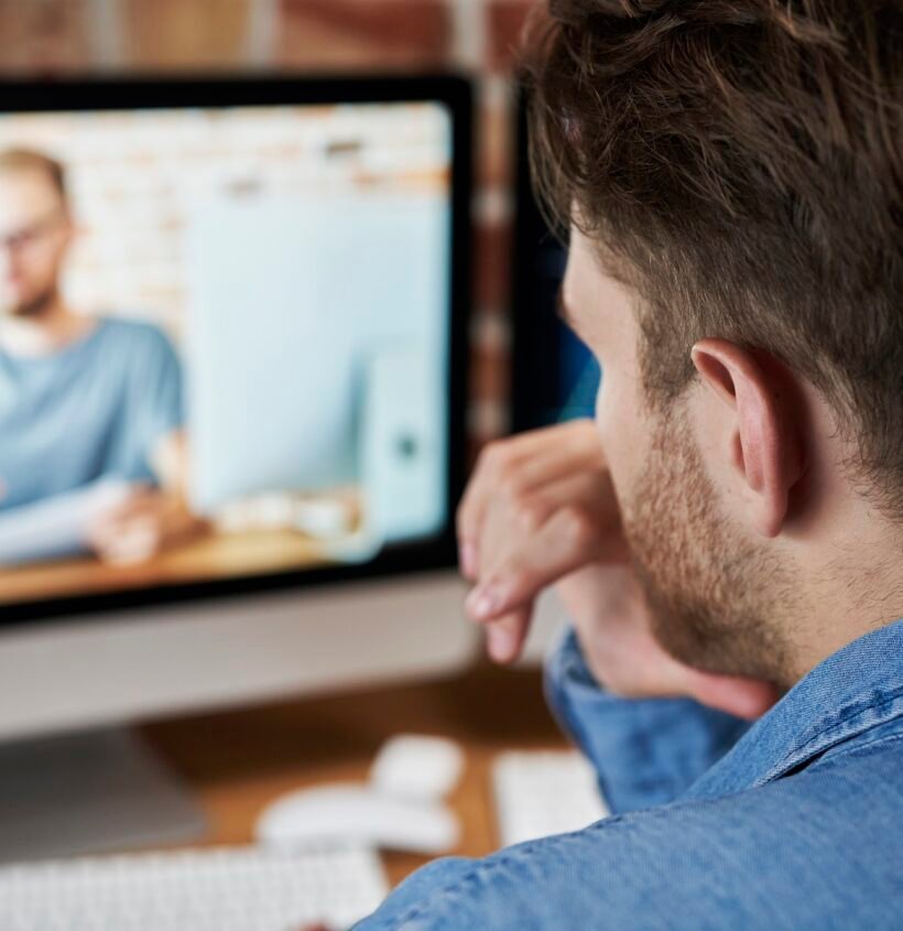 Adult man is taking an online management course