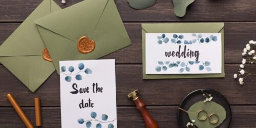 preparing-wedding-invitations-and-folding-envelopes-on-wood-scaled-1.jpg